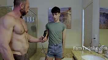 A hesitant stepson assists his father in trimming his pubic hair